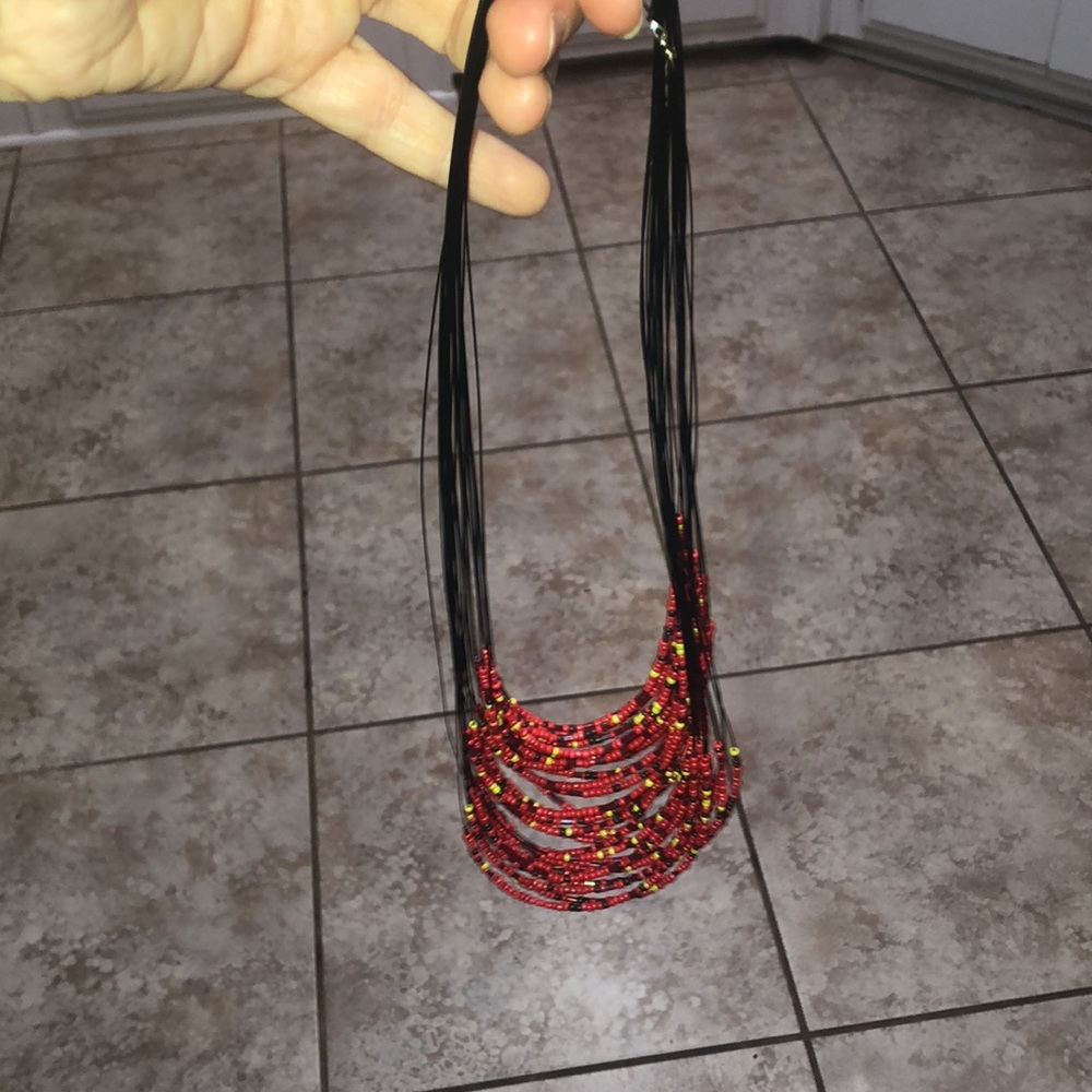 Black necklace made with light strings and beads